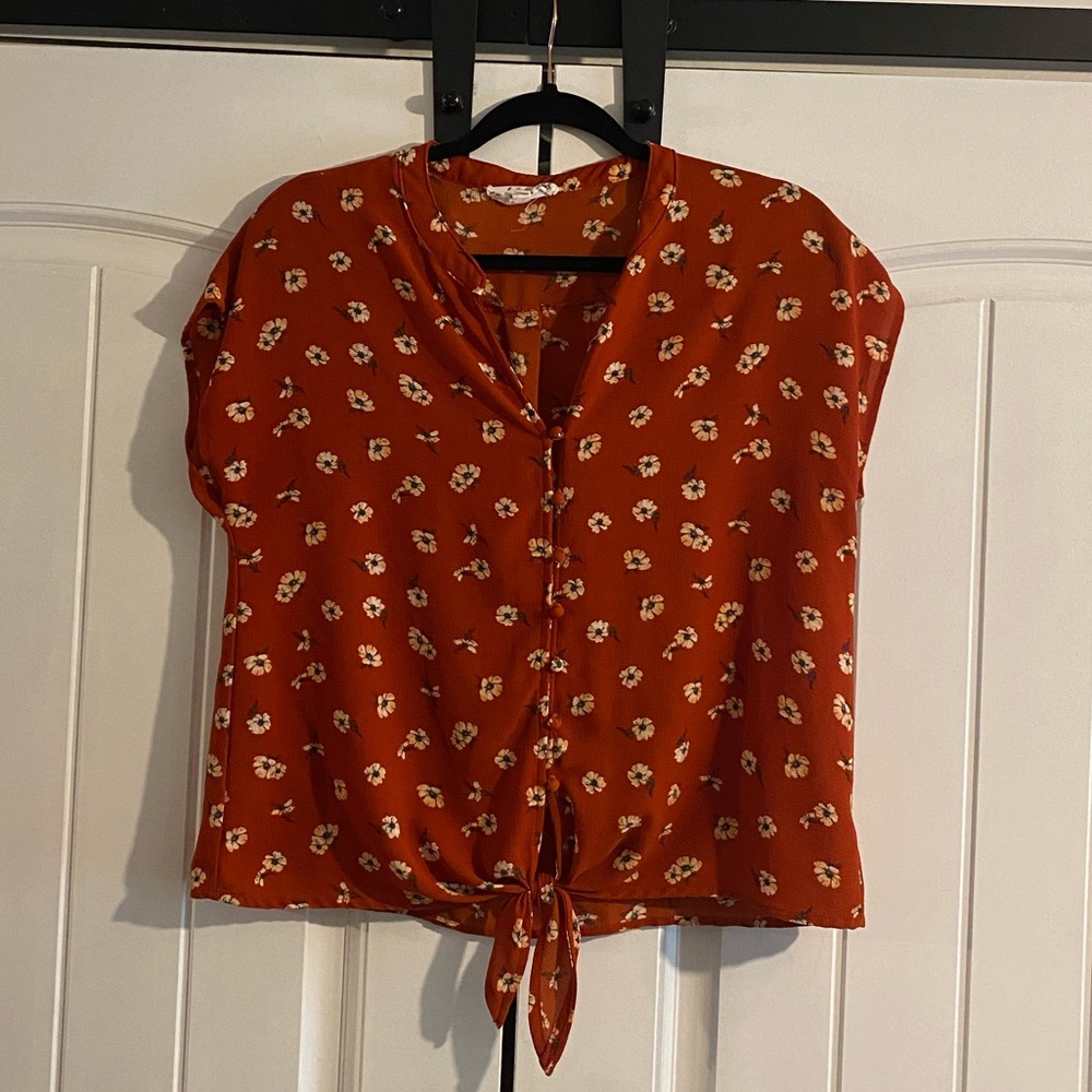 Burnt orange floral blouse